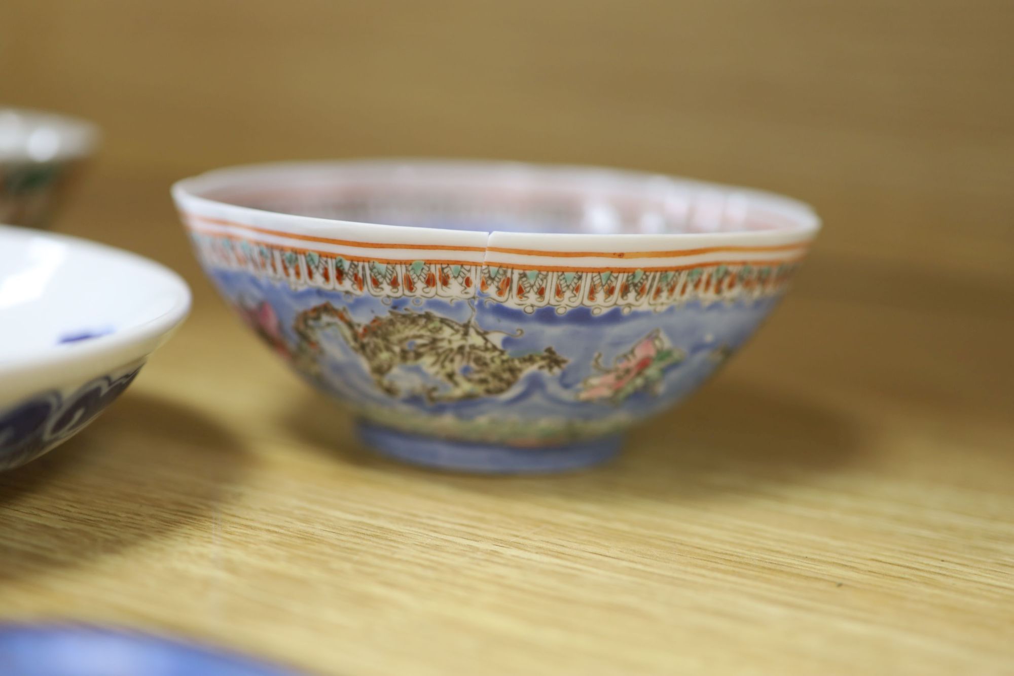 A quantity of Chinese and Japanese ceramics, including a blue and white dragon dish, a Cantonese famille rose dish, four cloisonne pi